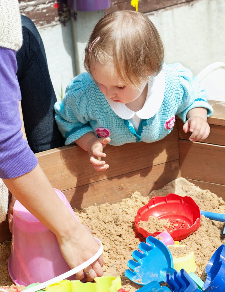 blond mother her little girl having fun together with the best soft play sand